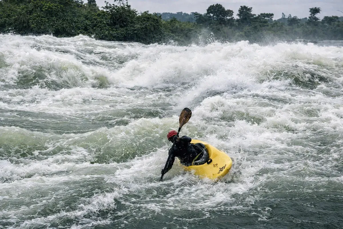 Kayaker battling Grade 5 waves