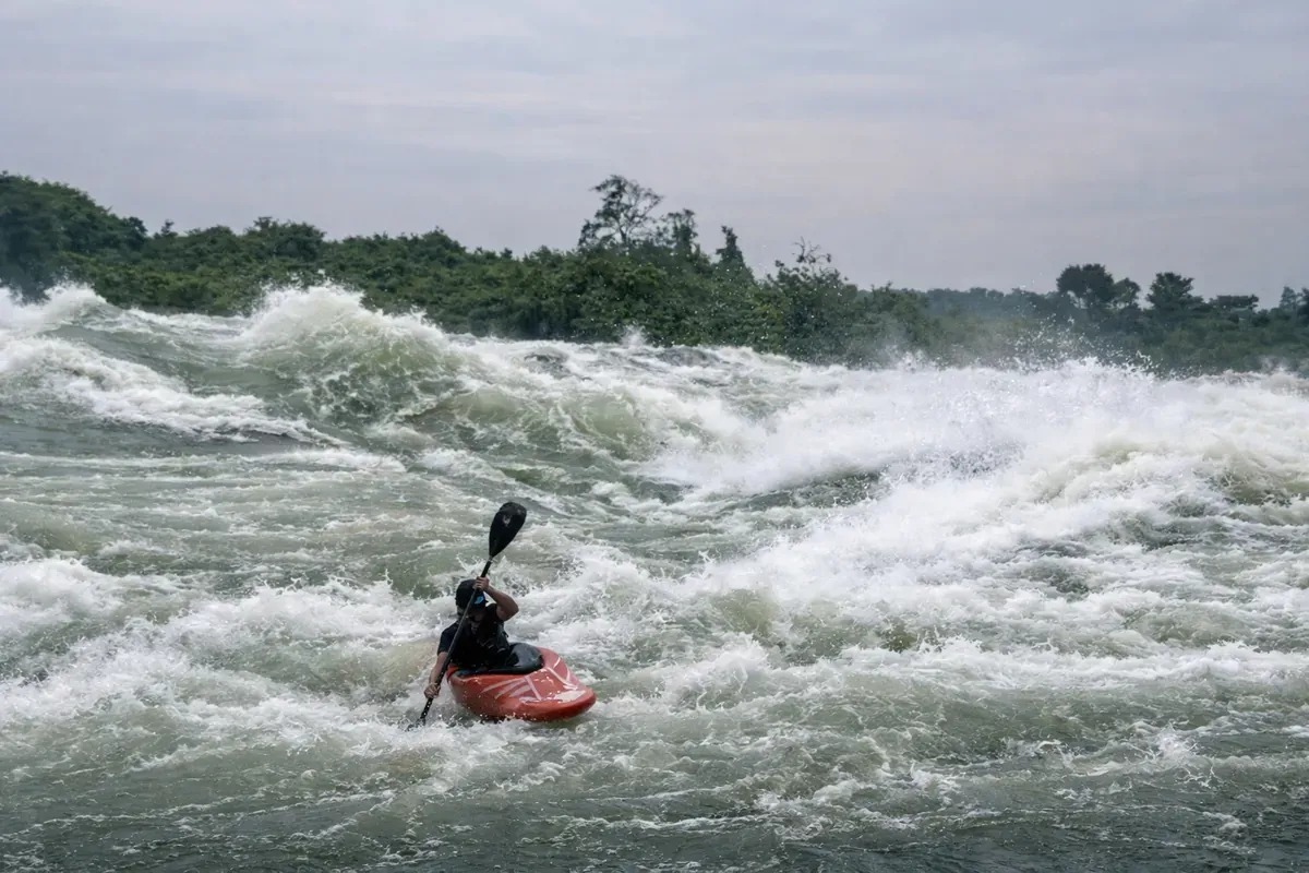 Kayaker navigating powerful white water