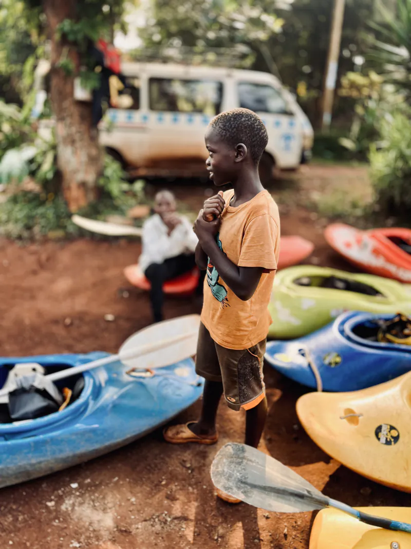 Young paddlers learning kayak skills at Bujagali challenge - Safe kayaking in Uganda